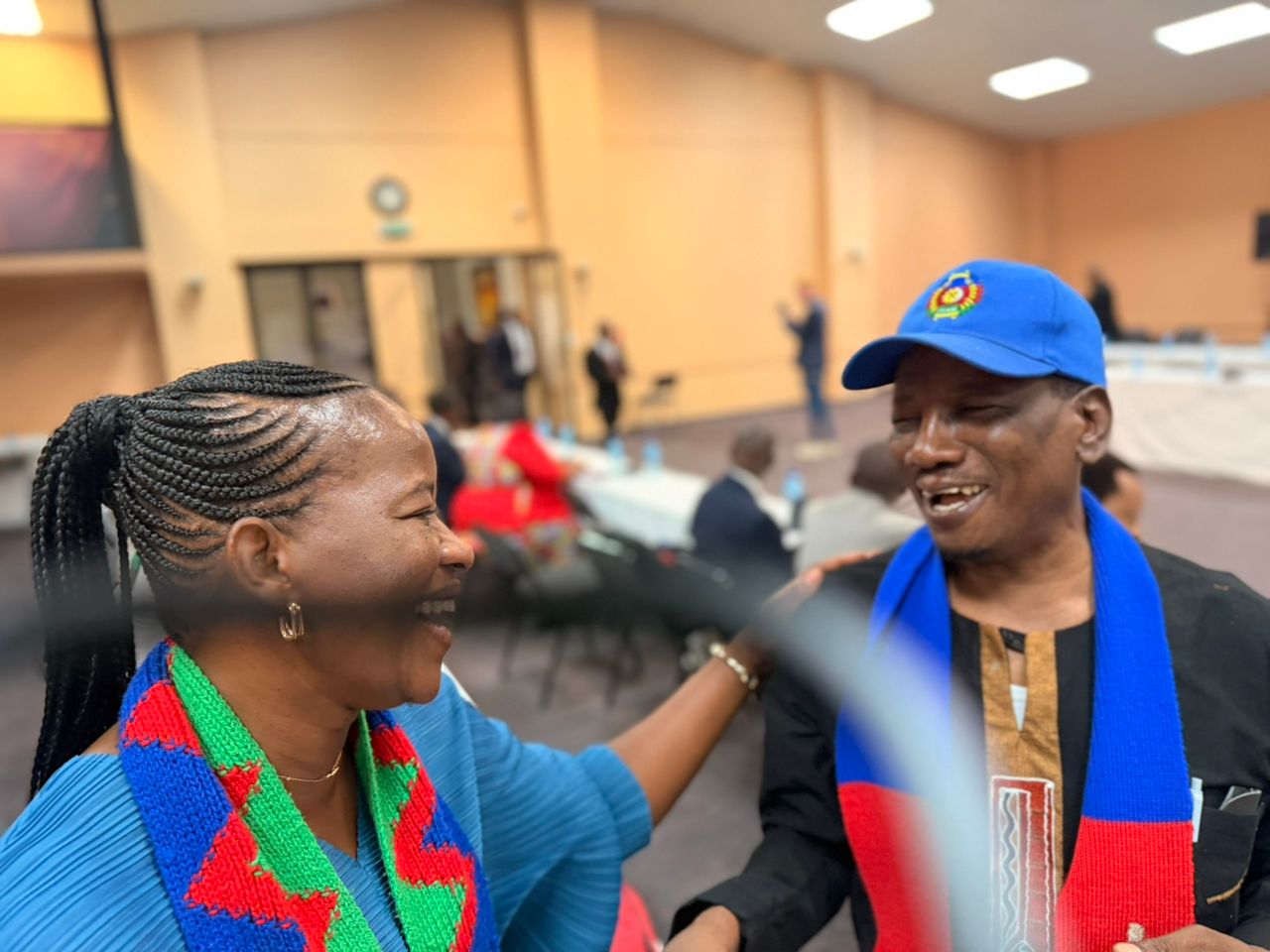 Warm greeting with fellow leaders wearing the Namibian flag scarves.