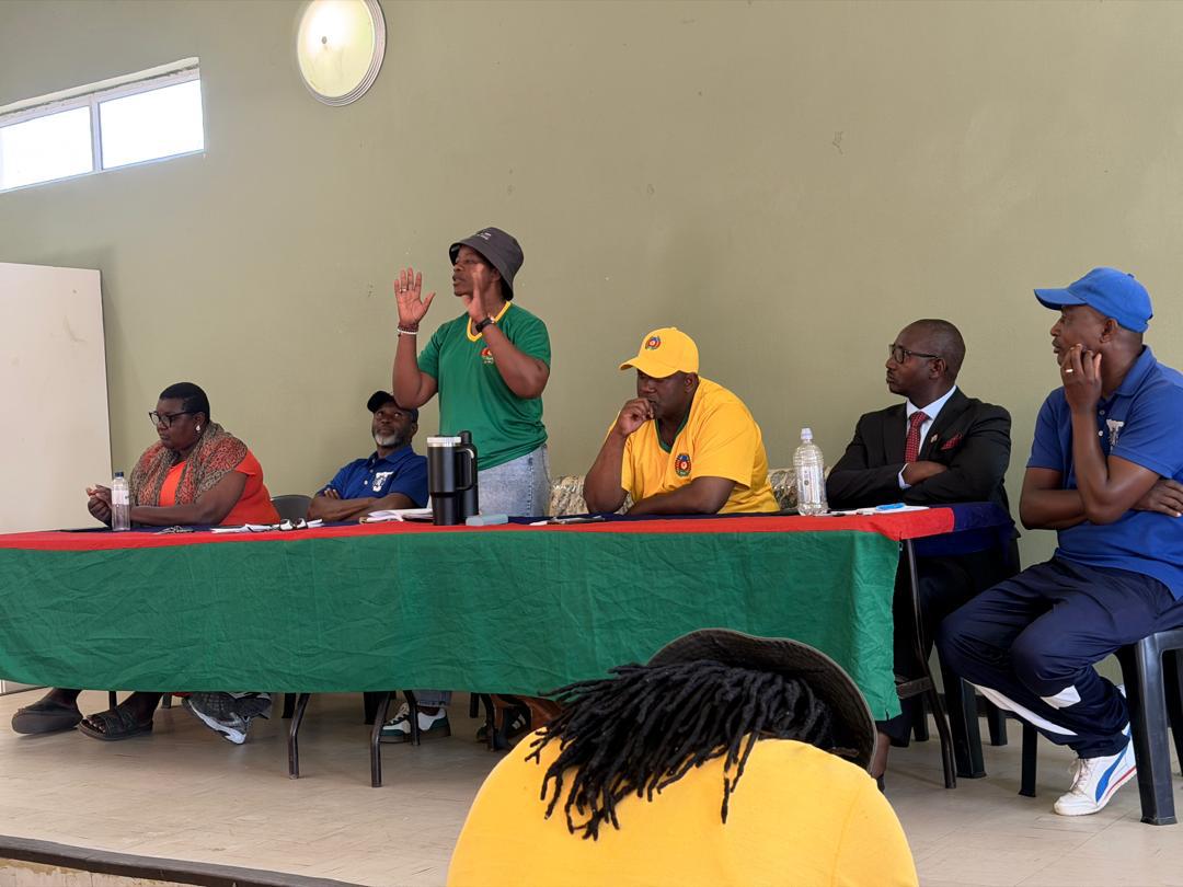 Union executive addressing panel members and the community.
